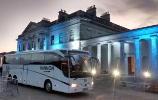 Coach bus outside of a building