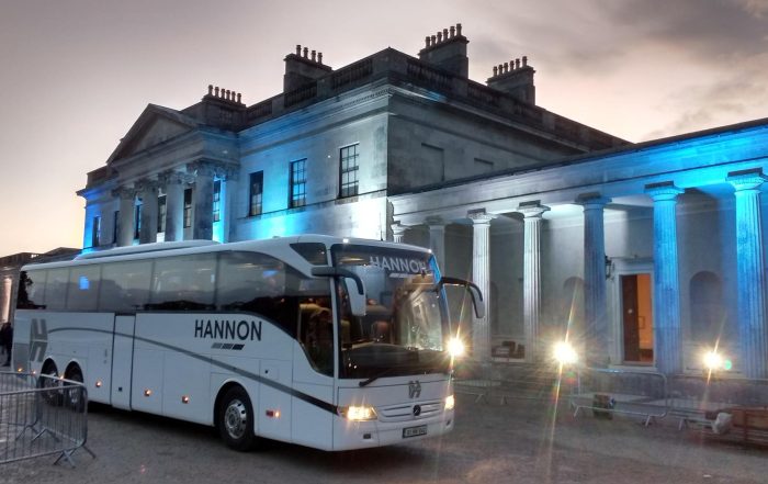 Coach bus outside of a building