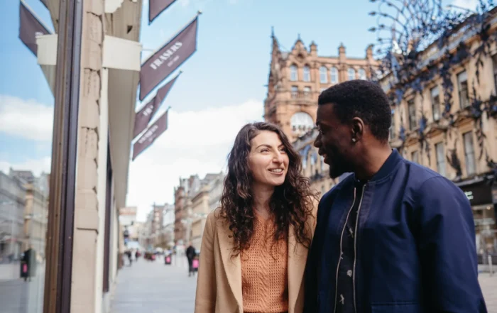 Two people talking outside